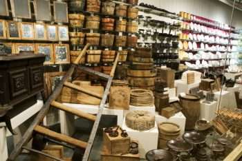 Dishes and Housewares Includes rope, tobacco, small animal traps, mirrors, stove, water buckets, dishware, candles, clay pipes, kettles, two-wheel dolly, and many more items.